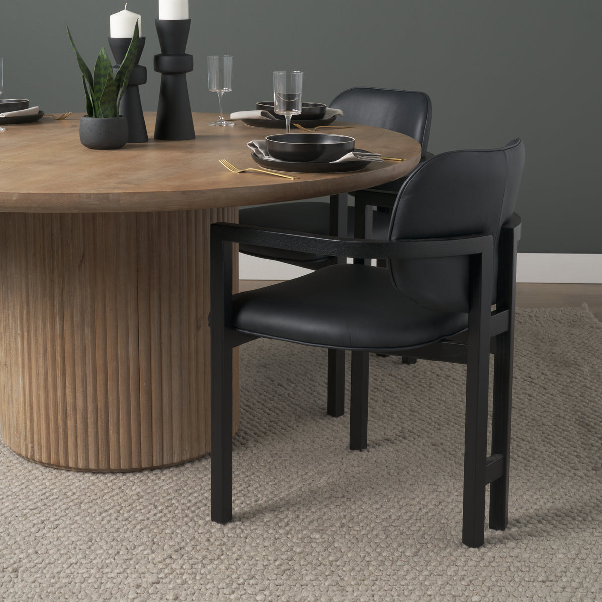 Carlisle Curved Back Black Leather Tripod Frame Dining Armchair from Mercana - Luna Furniture