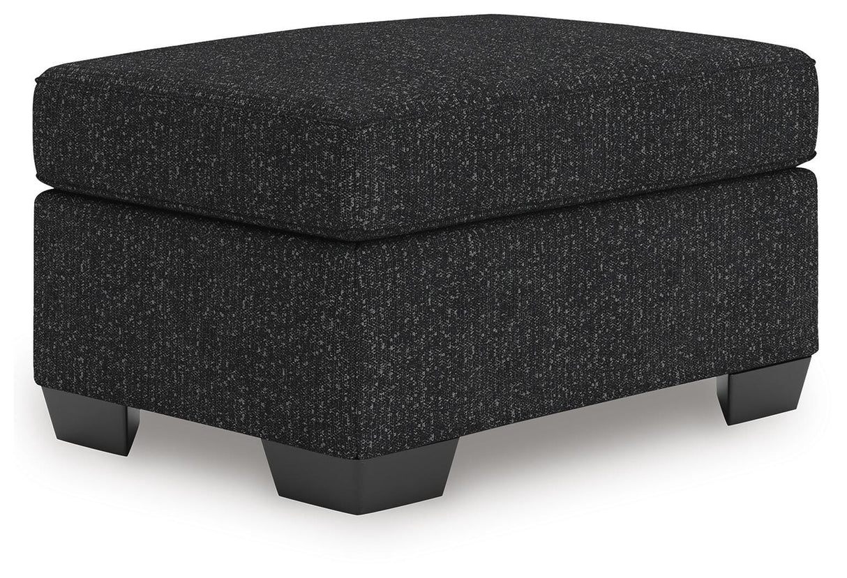 Jasmine Peaks Coal Ottoman from Ashley Furniture - Luna Furniture