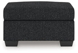 Jasmine Peaks Coal Ottoman from Ashley Furniture - Luna Furniture