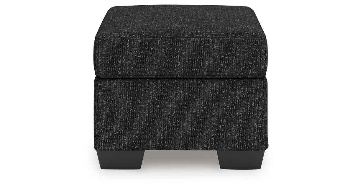 Jasmine Peaks Coal Ottoman from Ashley Furniture - Luna Furniture