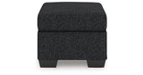 Jasmine Peaks Coal Ottoman from Ashley Furniture - Luna Furniture