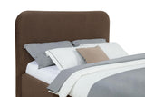 Anders Chocolate Queen storage lift bed, upholstered headboard and layered bedding, close three-quarter view
