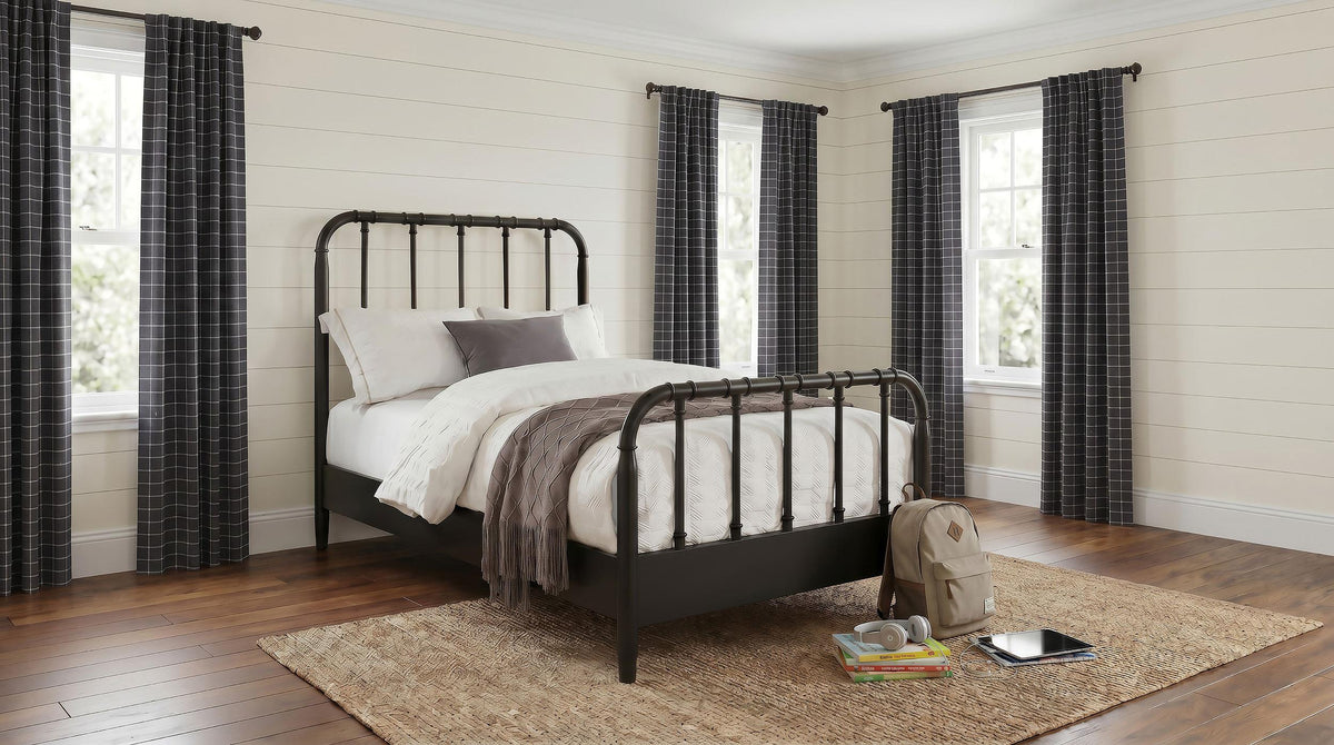 Rocco Dark Bronze Twin Bed, staged bedroom view with rug and curtains