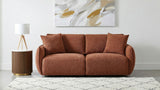 Elysia Coral modular loveseat in living room, coral chenille upholstery, styled front view