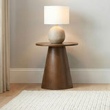 Franklin Dark round pedestal side table, styled with lamp, dark wood finish