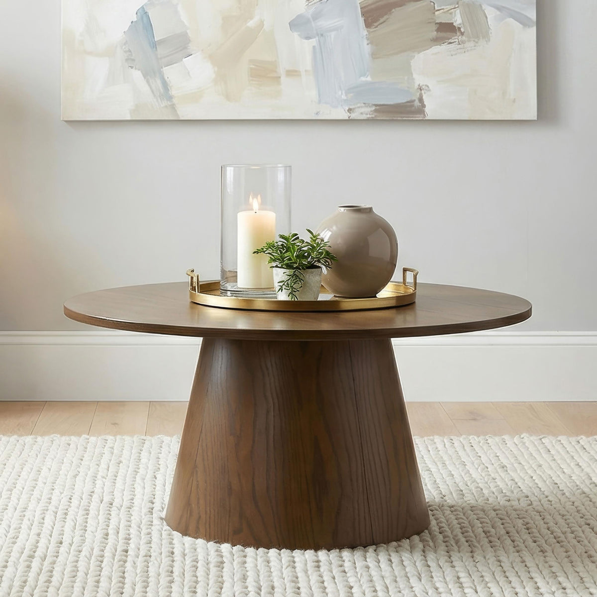 Franklin Dark round coffee table, dark brown wood grain, styled room view