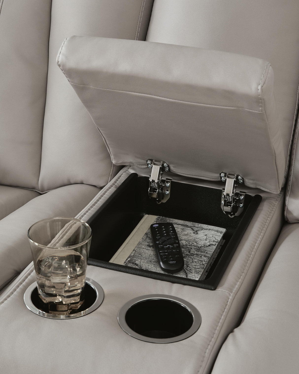 Elevate Edges Coin Glider Reclining Loveseat with Console from Ashley Furniture - Luna Furniture