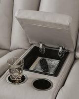 Elevate Edges Coin Glider Reclining Loveseat with Console from Ashley Furniture - Luna Furniture