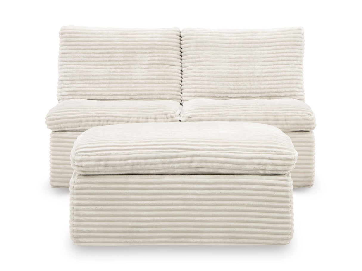 Fannin Ivory Armless Chair with Ottoman from Ashley - Luna Furniture