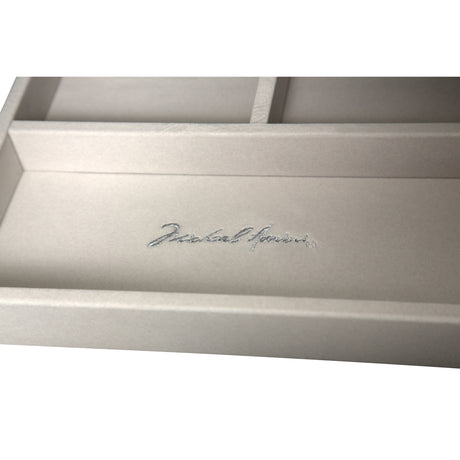 Melrose Plaza Dove Upholstered Swivel Chest from Michael Amini - Luna Furniture