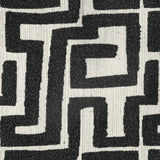Eimer Black accent chair, side profile, bold black-and-ivory jacquard upholstery