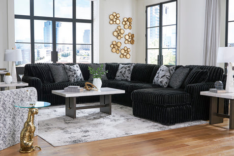 Midnight-Madness 4-Piece Sectional with Ottoman in Onyx from Ashley - Luna Furniture