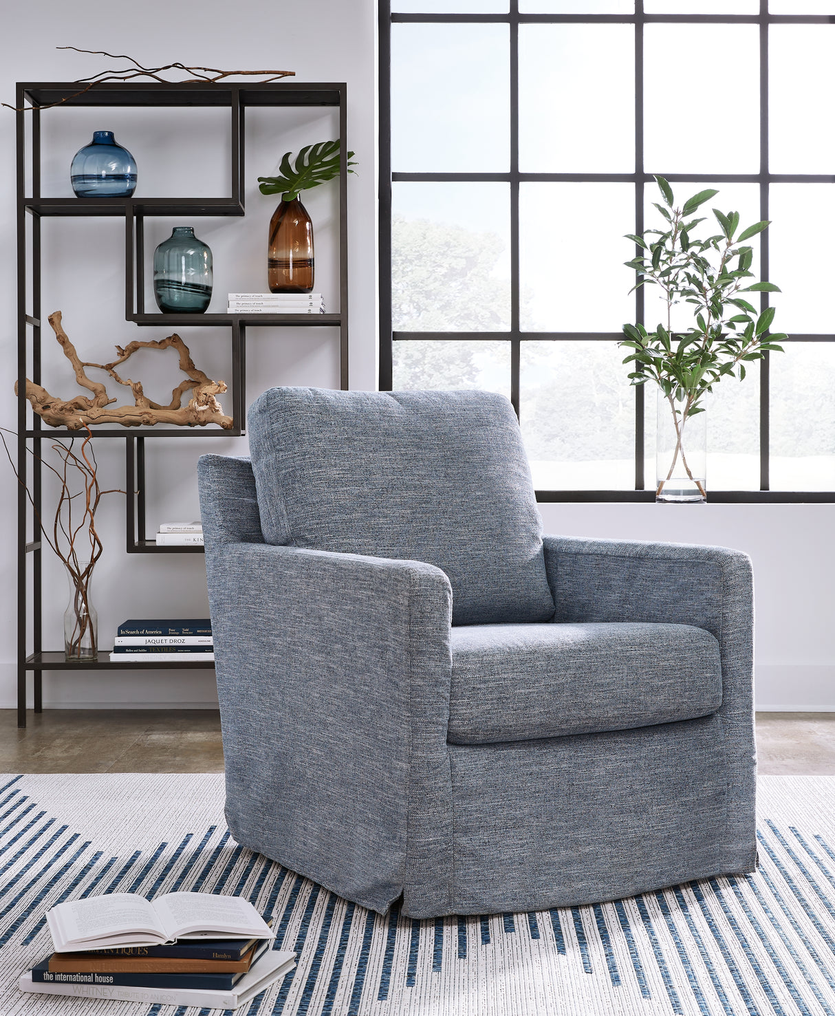 Nenana Next-Gen Nuvella Denim Swivel Glider Accent Chair from Ashley - Luna Furniture