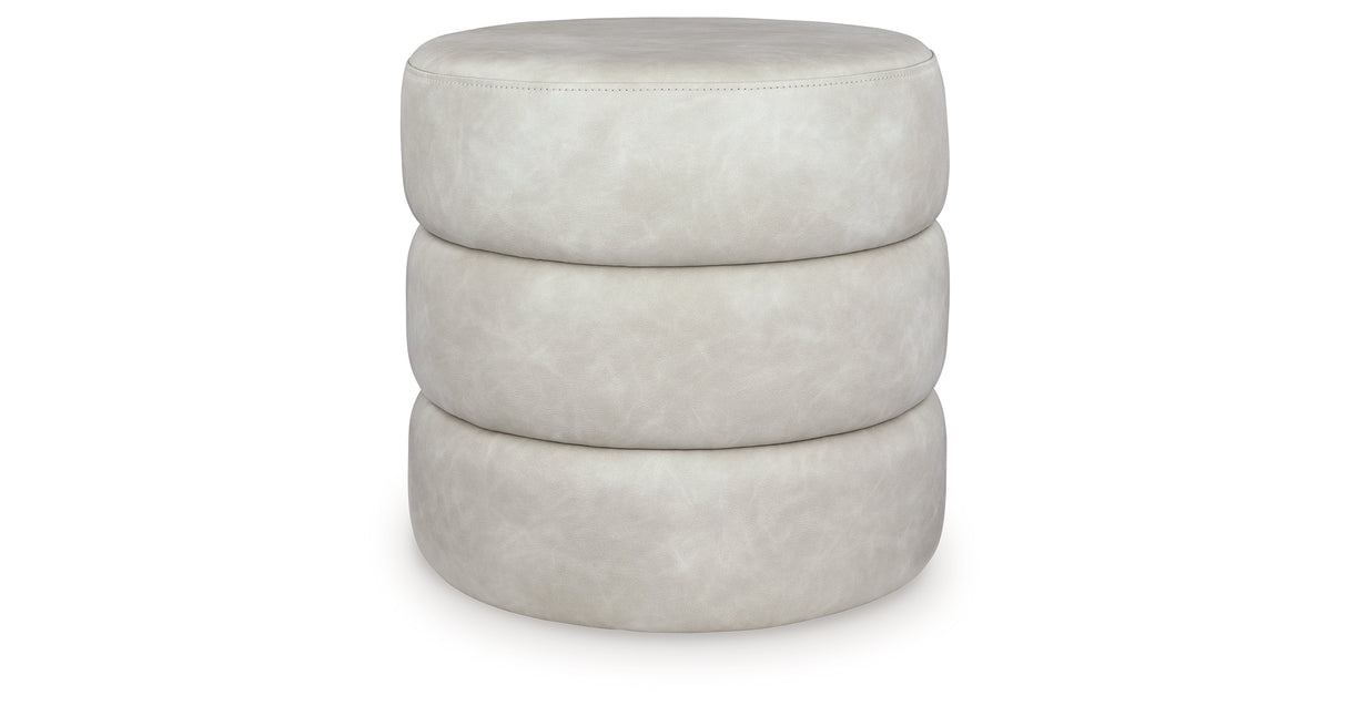 Ummi Bone Swivel Accent Ottoman from Ashley - Luna Furniture