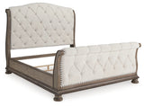 Ardenfield Light Brown Queen Upholstered Sleigh Bed from Ashley - Luna Furniture