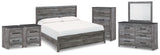 Bronyan King Panel Bed with Mirrored Dresser, Chest and 2 Nightstands in Dark Gray from Ashley Furniture - Luna Furniture