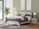Lawroy Queen Panel Bed with Mirrored Dresser and Nightstand in Light Natural from Ashley - Luna Furniture