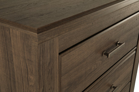 Juararo King Poster Bed with Mirrored Dresser and Chest in Dark Brown from Ashley Furniture - Luna Furniture