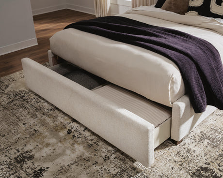 Brizmore Beige Queen Upholstered Storage Bed from Ashley - Luna Furniture