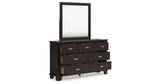 Covetown Queen Panel Bed with Mirrored Dresser and Chest in Dark Brown from Ashley Furniture - Luna Furniture