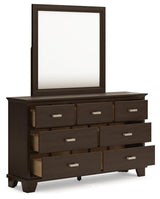 Covetown California King Panel Bed with Mirrored Dresser in Dark Brown from Ashley Furniture - Luna Furniture