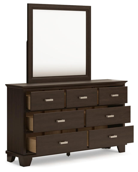 Covetown Queen Panel Bed with Mirrored Dresser in Dark Brown from Ashley Furniture - Luna Furniture