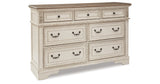 Realyn Chipped White Queen Upholstered Panel Bed, Dresser and Nightstand from Ashley - Luna Furniture