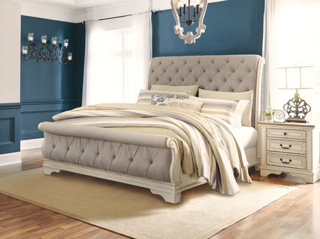 Realyn Chipped White Queen Upholstered Sleigh Bed from Ashley - Luna Furniture