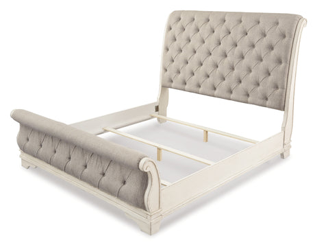 Realyn Chipped White Queen Upholstered Sleigh Bed from Ashley - Luna Furniture