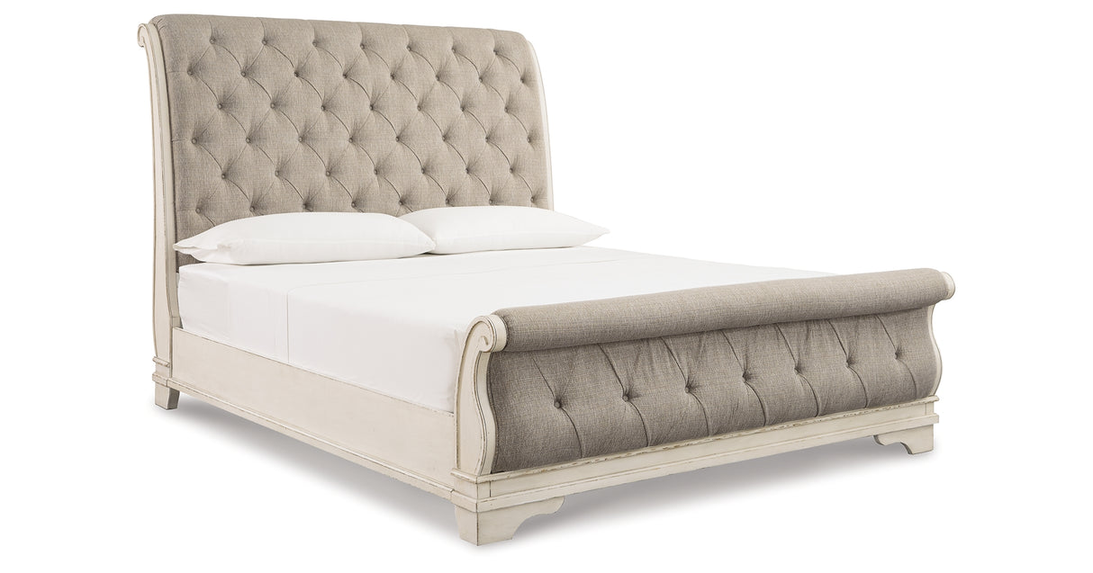 Realyn Chipped White King Upholstered Sleigh Bed from Ashley - Luna Furniture