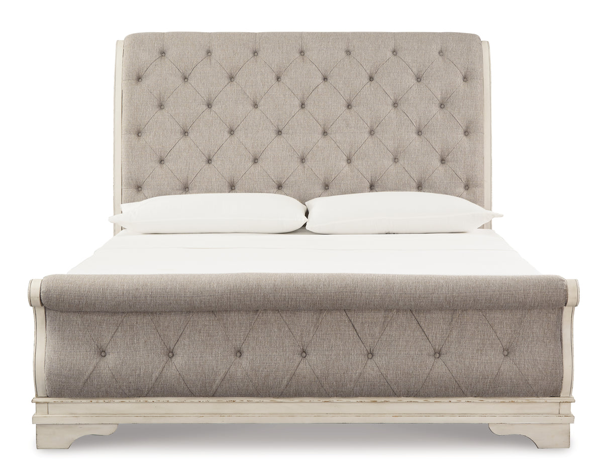 Realyn Chipped White California King Upholstered Sleigh Bed from Ashley - Luna Furniture