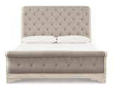 Realyn Chipped White California King Upholstered Sleigh Bed from Ashley - Luna Furniture