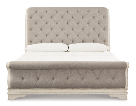 Realyn Chipped White California King Upholstered Sleigh Bed from Ashley - Luna Furniture