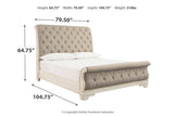 Realyn Chipped White Queen Upholstered Sleigh Bed from Ashley - Luna Furniture