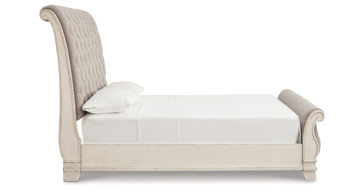 Realyn Two-tone Queen Upholstered Sleigh Bed and Chest from Ashley Furniture - Luna Furniture