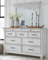Kanwyn King Panel Bed with Mirrored Dresser, Chest and 2 Nightstands in Whitewash from Ashley Furniture - Luna Furniture
