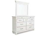 Kanwyn California King Panel Bed with Mirrored Dresser and Chest in Whitewash from Ashley Furniture - Luna Furniture