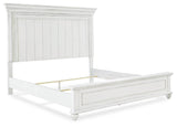 Kanwyn King Panel Bed with Mirrored Dresser, Chest and 2 Nightstands in Whitewash from Ashley - Luna Furniture
