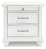 Kanwyn King Panel Bed with Mirrored Dresser, Chest and 2 Nightstands in Whitewash from Ashley Furniture - Luna Furniture
