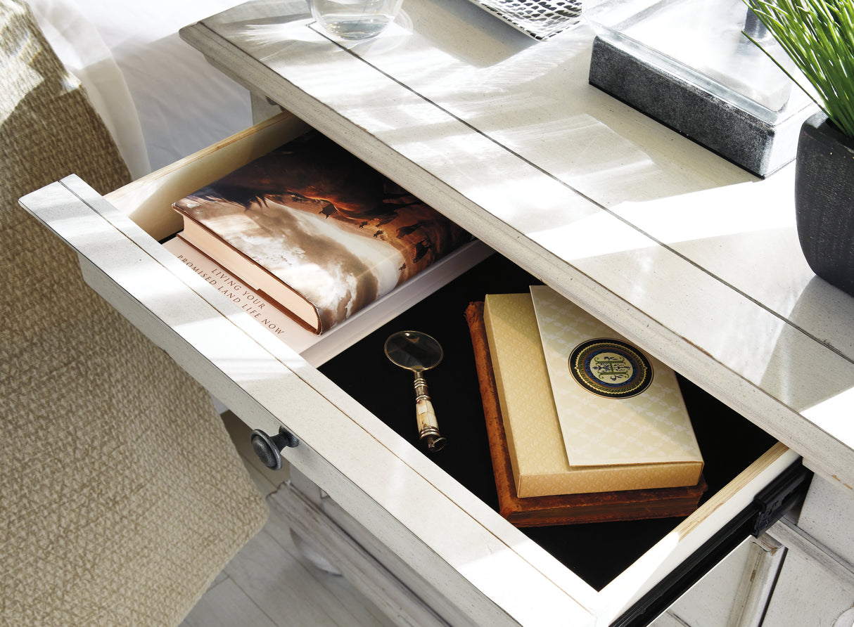 Kanwyn King Panel Bed with Mirrored Dresser, Chest and 2 Nightstands in Whitewash from Ashley Furniture - Luna Furniture