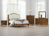 Sturlayne Brown Queen Upholstered Panel Bed with Footboard Bench from Ashley Furniture - Luna Furniture