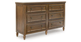 Sturlayne Queen Upholstered Panel Bed with Dresser and 2 Nightstands in Brown from Ashley - Luna Furniture