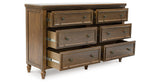 Sturlayne Queen Upholstered Panel Bed with Dresser and 2 Nightstands in Brown from Ashley - Luna Furniture
