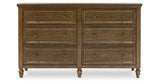 Sturlayne Queen Upholstered Panel Bed with Dresser and 2 Nightstands in Brown from Ashley - Luna Furniture