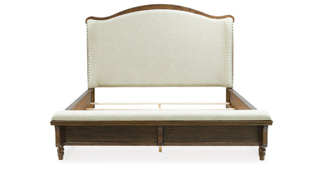 Sturlayne Queen Upholstered Panel Bed with Mirrored Dresser and Chest in Brown from Ashley Furniture - Luna Furniture