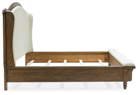 Sturlayne Brown California King Upholstered Panel Bed with Footboard Bench from Ashley Furniture - Luna Furniture