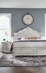 Montelaine Antique White Queen Upholstered Panel Bed from Ashley - Luna Furniture