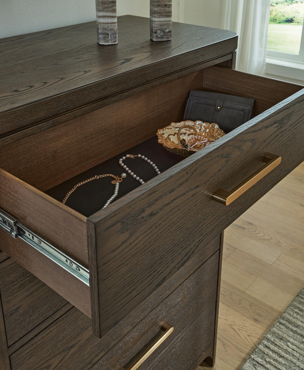 Radkin Burnished Brown Chest of Drawers from Ashley - Luna Furniture