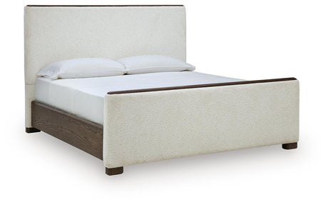 Radkin Burnished Brown Queen Uphostered Panel Bed from Ashley - Luna Furniture