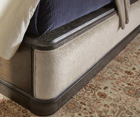 Wickenger Dark Brown California King Upholstered Panel Bed from Ashley - Luna Furniture